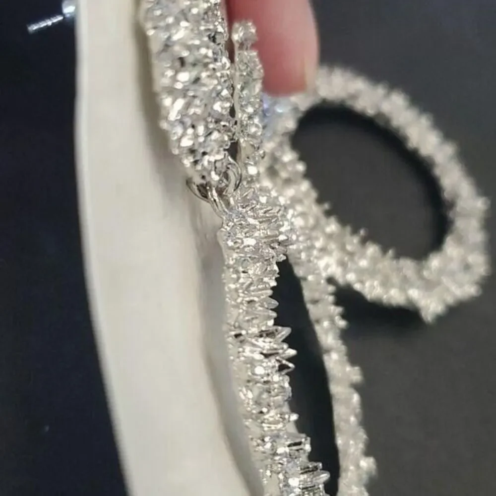 Silver tone circular themed statement earrings texture chunky